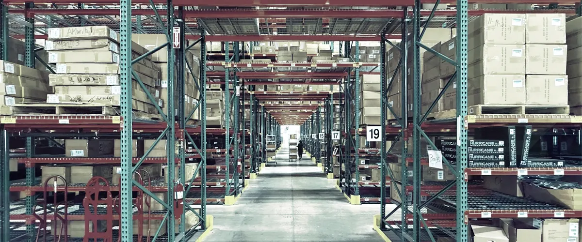 A warehouse with shelving full of stock